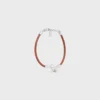 Bracciale a nodo in pelle di vitello e ottone con finitura in rodio Bracciale a nodo in pelle di vitello e ottone con finitura in rodio