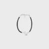 Bracciale a nodo in pelle di vitello e ottone con finitura in rodio Bracciale a nodo in pelle di vitello e ottone con finitura in rodio