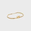 Bracciale articolato Triomphe in ottone con finitura dorata Bracciale articolato Triomphe in ottone con finitura dorata