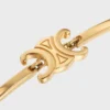 Bracciale articolato Triomphe in ottone con finitura dorata Bracciale articolato Triomphe in ottone con finitura dorata