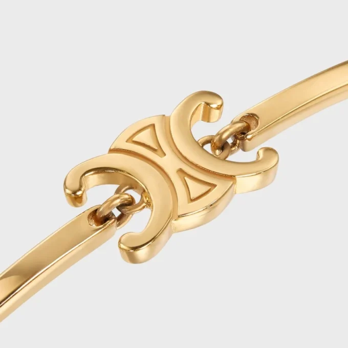 Bracciale articolato Triomphe in ottone con finitura dorata Bracciale articolato Triomphe in ottone con finitura dorata