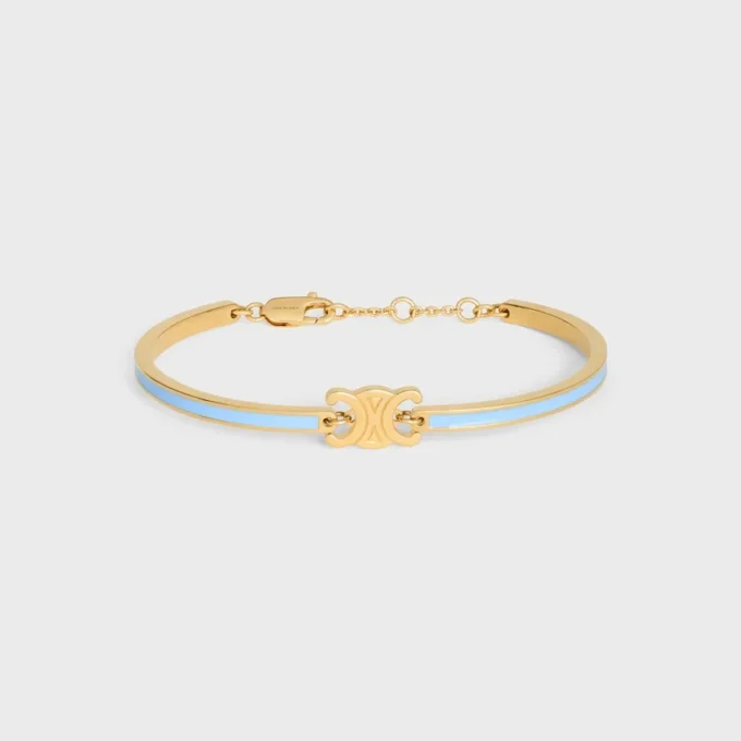 Bracciale articolato Triomphe in smalto e ottone con finitura dorata Bracciale articolato Triomphe in smalto e ottone con finitura dorata