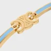 Bracciale articolato Triomphe in smalto e ottone con finitura dorata Bracciale articolato Triomphe in smalto e ottone con finitura dorata