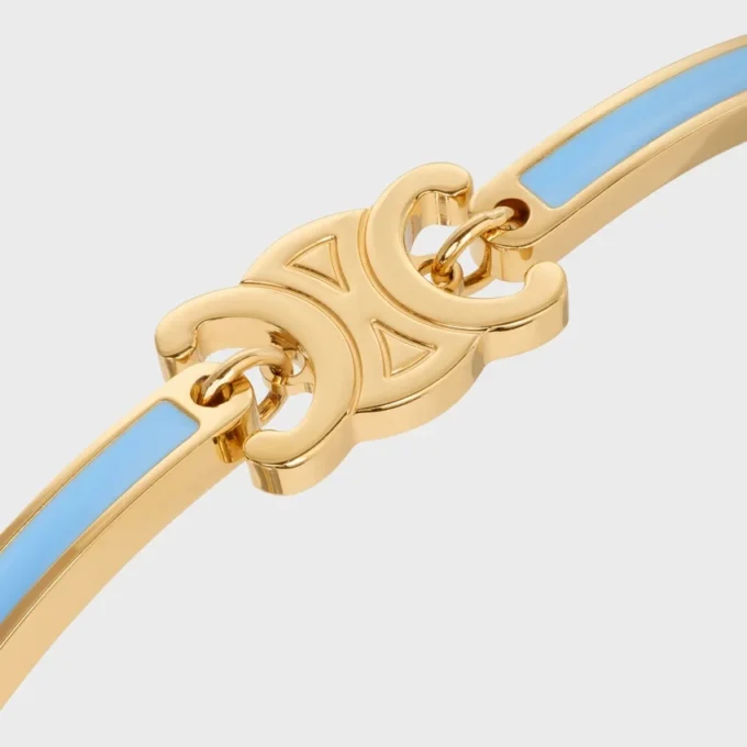 Bracciale articolato Triomphe in smalto e ottone con finitura dorata Bracciale articolato Triomphe in smalto e ottone con finitura dorata