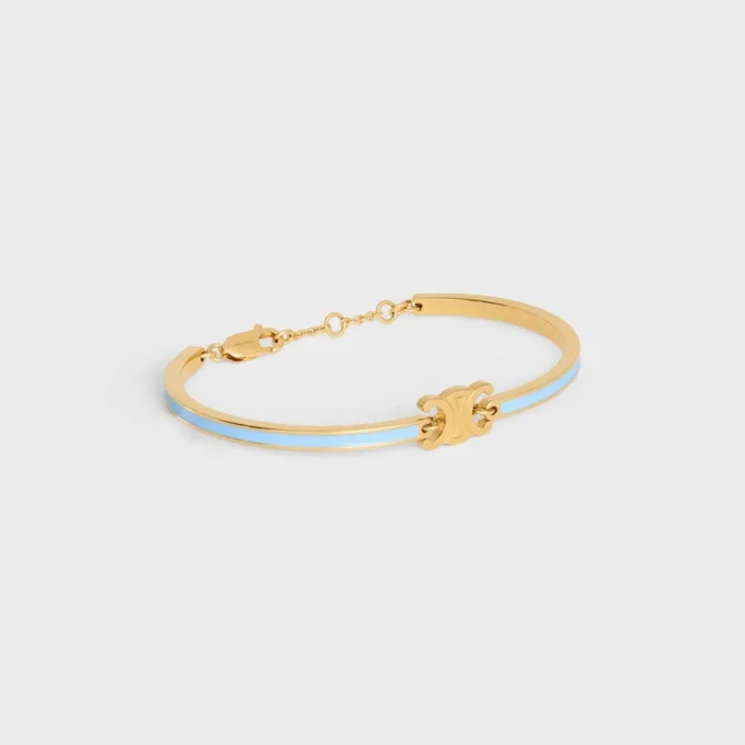 Bracciale articolato Triomphe in smalto e ottone con finitura dorata Bracciale articolato Triomphe in smalto e ottone con finitura dorata