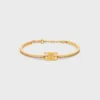 Bracciale articolato Triomphe Sparkle in strass e ottone con finitura dorata Bracciale articolato Triomphe Sparkle in strass e ottone con finitura dorata