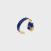 Bracciale rigido CELINE con nodo in smalto e ottone con finitura dorata Bracciale rigido CELINE con nodo in smalto e ottone con finitura dorata