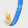 Bracciale rigido CELINE Ribbon Small in smalto e ottone con finitura dorata Bracciale rigido CELINE Ribbon Small in smalto e ottone con finitura dorata