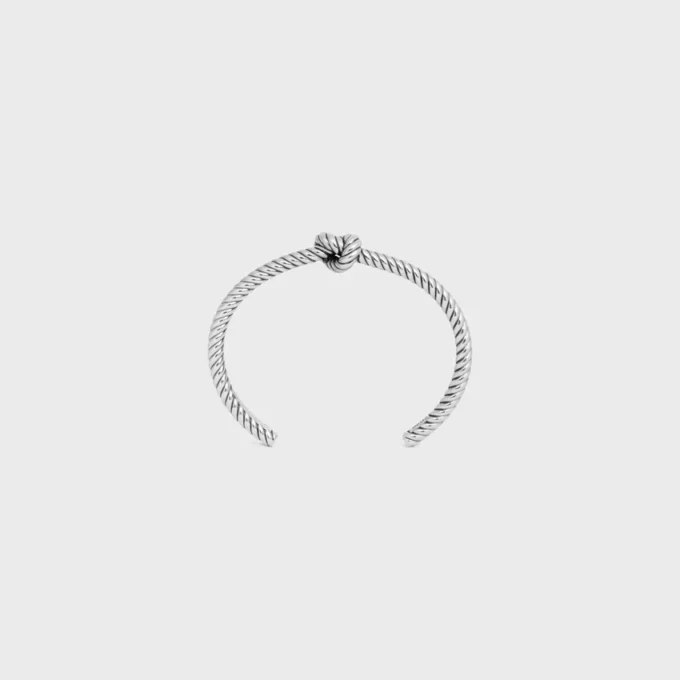 Bracciale rigido con motivo a cordino annodato in ottone con finitura al rodio