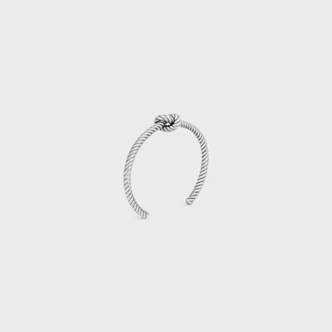 Bracciale rigido con motivo a cordino annodato in ottone con finitura al rodio
