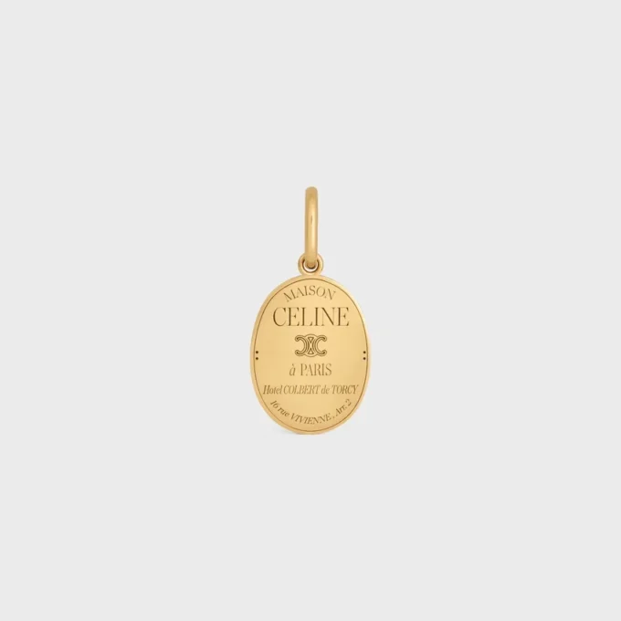 Ciondolo CELINE in ottone con finitura dorata Ciondolo CELINE in ottone con finitura dorata