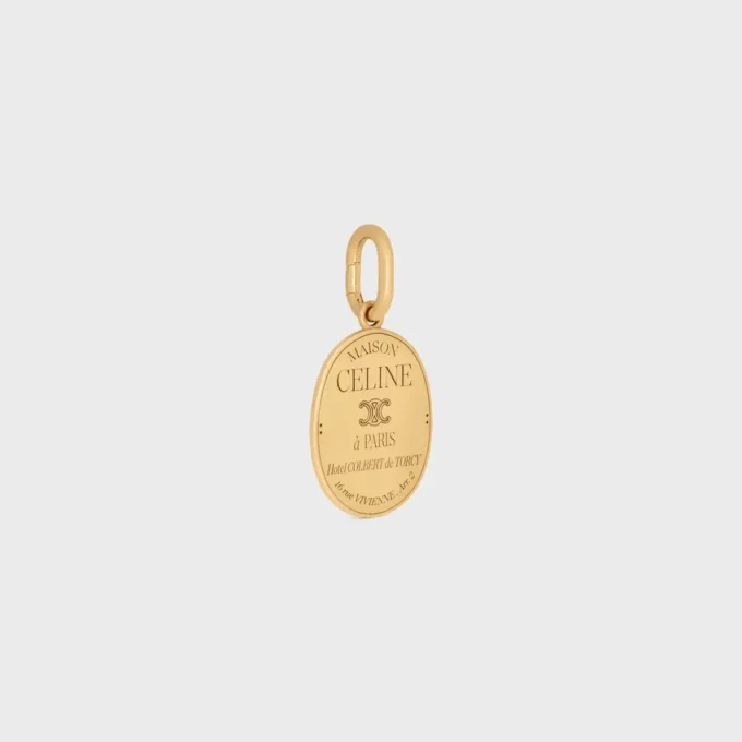 Ciondolo CELINE in ottone con finitura dorata Ciondolo CELINE in ottone con finitura dorata