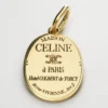 Ciondolo CELINE in ottone con finitura dorata Ciondolo CELINE in ottone con finitura dorata