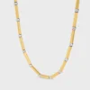 Collana lunga con ciondoli in ottone con finitura in oro e rodio Collana lunga con ciondoli in ottone con finitura in oro e rodio