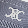 Cuscino Triomphe in cotone a righe