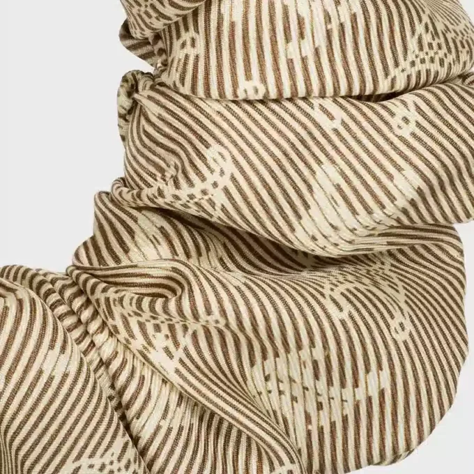 Elastico per capelli CELINE Triomphe Diagonale in seta e ottone con finitura dorata Elastico per capelli CELINE Triomphe Diagonale in seta e ottone con finitura dorata
