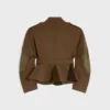 Giacca con peplo in lana a righe diagonali Giacca con peplo in lana a righe diagonali