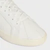 Sneaker CELINE Lou Low con lacci e logo Triomphe in tela e pelle di vitello Sneaker CELINE Lou Low con lacci e logo Triomphe in tela e pelle di vitello